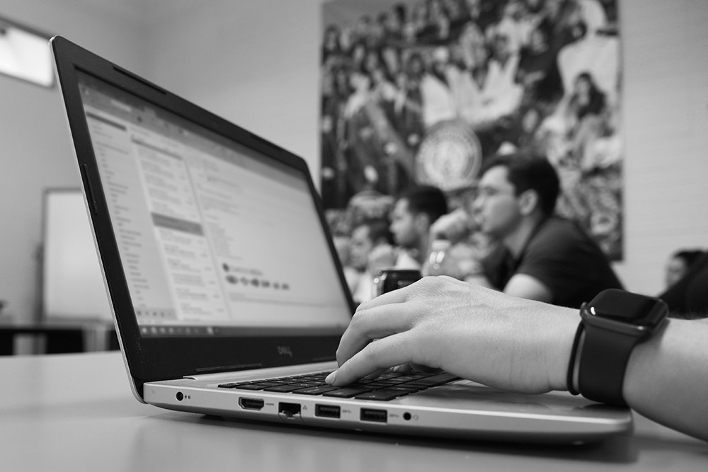 Person typing on laptop